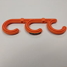 Load image into Gallery viewer, front image of tidi-hook, a triple hook safety product from temporary extension cords