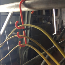 Load image into Gallery viewer, tidi-hanger triple safety hook hanging from a handrail to carry temporary 110v cords