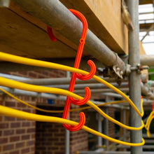 Load image into Gallery viewer, Tidi-Hanger triple safey hook hung over scaffolding to carry temporary extension cords
