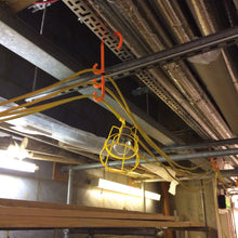 Load image into Gallery viewer, tidi-hanger triple safety hook being used to hang temporary festoon lighting on a construction site